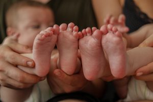 Twin babies and their bare feet